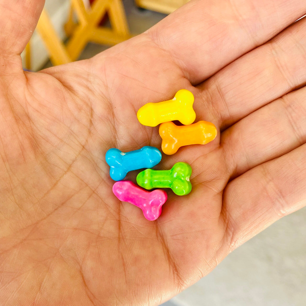 Colorful fruit-flavored penis-shaped candy pieces