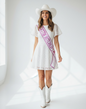Littlegenie.com white bridal sash with pink glitter text "Gettin Hitched" and cowboy boot graphic.